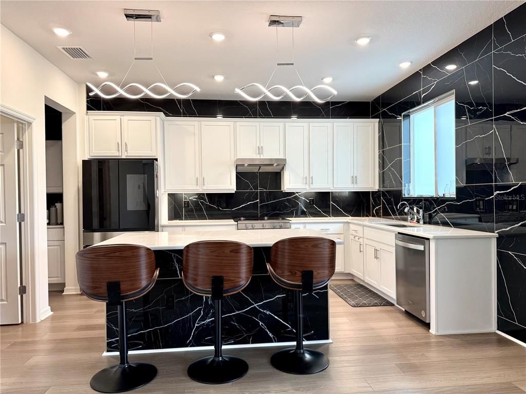 Interior, Kitchen, Marble Walls, Pendant Lights, Recessed Lighting, Wood Texture Flooring