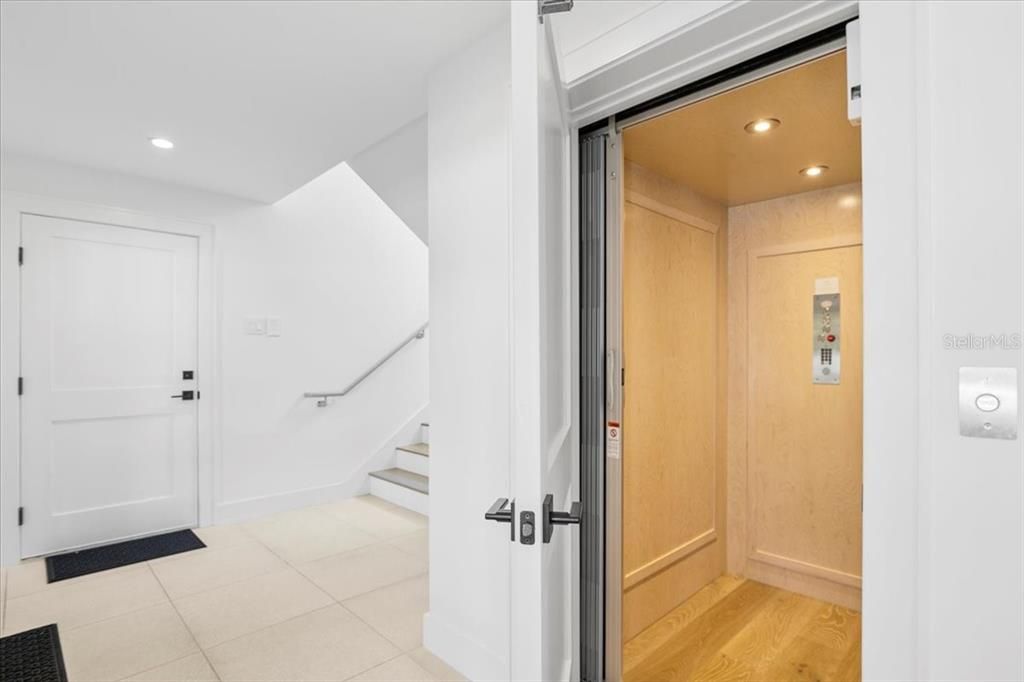 Elevator, Interior, Recessed Lighting, Wood Texture Flooring, Wooden Walls