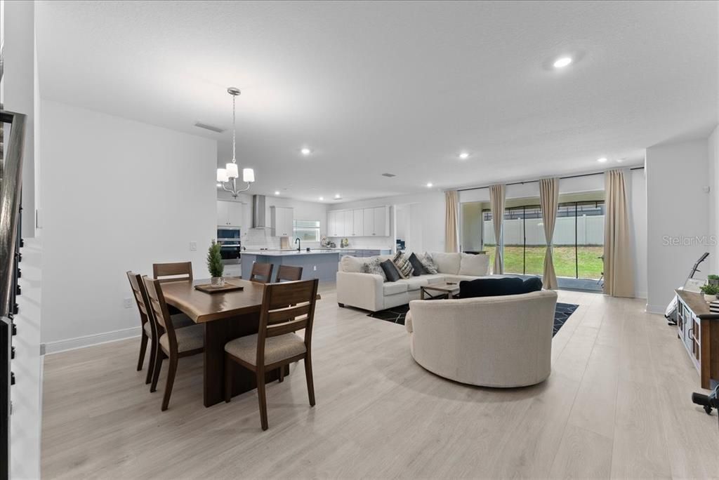Chandelier, Dining room, Interior, Kitchen, Living room, Pendant Lights, Recessed Lighting, Wood Texture Flooring