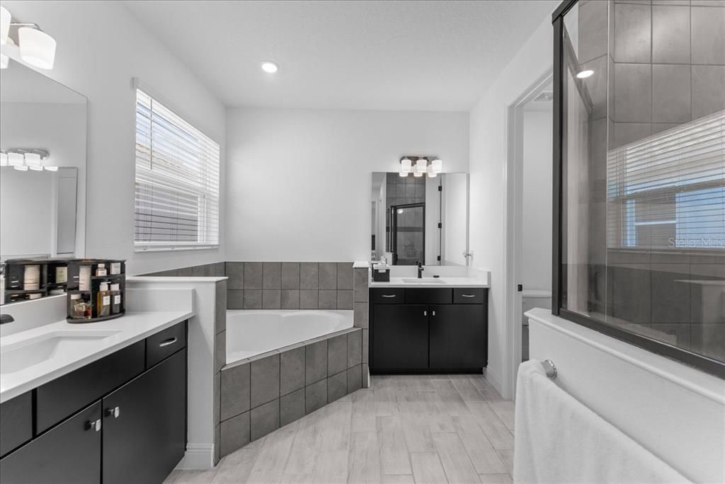 Bathroom, Dual Sink Vanities, Glass Shower, Interior, Recessed Lighting, Wood Texture Flooring