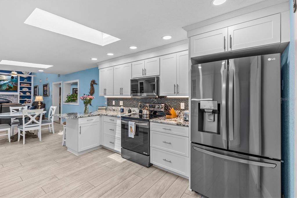 Dining room, Interior, Kitchen, Recessed Lighting, Stainless Steel Appliances, Wood Texture Flooring