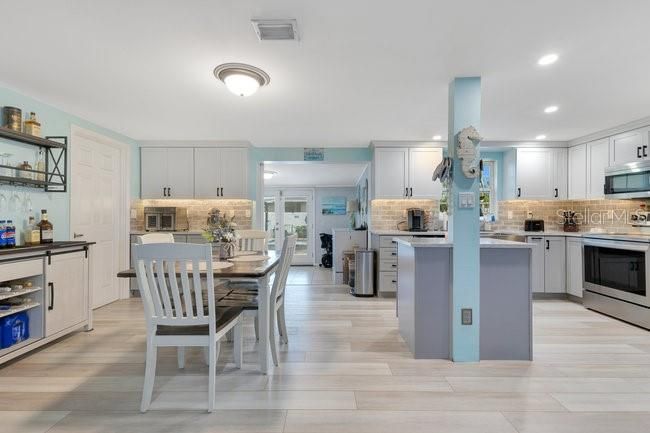 Dining room, Interior, Kitchen, Recessed Lighting, Stainless Steel Appliances, Wood Texture Flooring