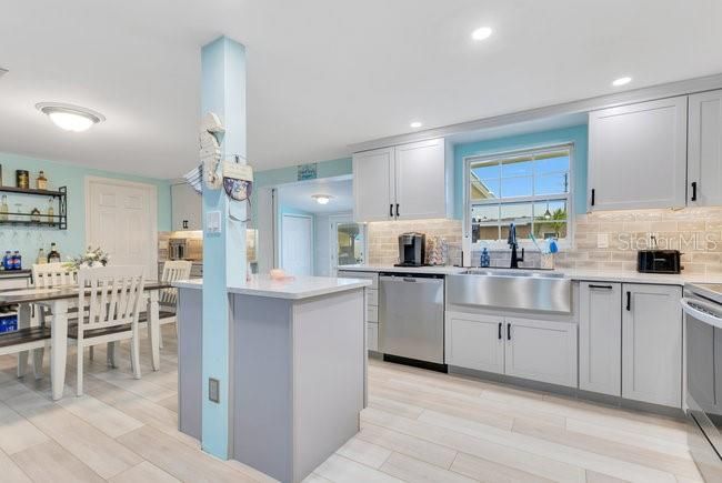 Dining room, Interior, Kitchen, Recessed Lighting, Stainless Steel Appliances, Wood Texture Flooring