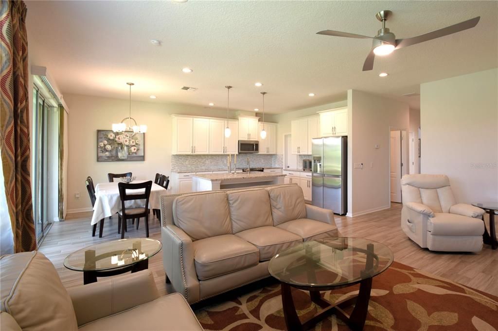 Dining room, Interior, Kitchen, Living room, Pendant Lights, Recessed Lighting, Stainless Steel Appliances, Wood Texture Flooring