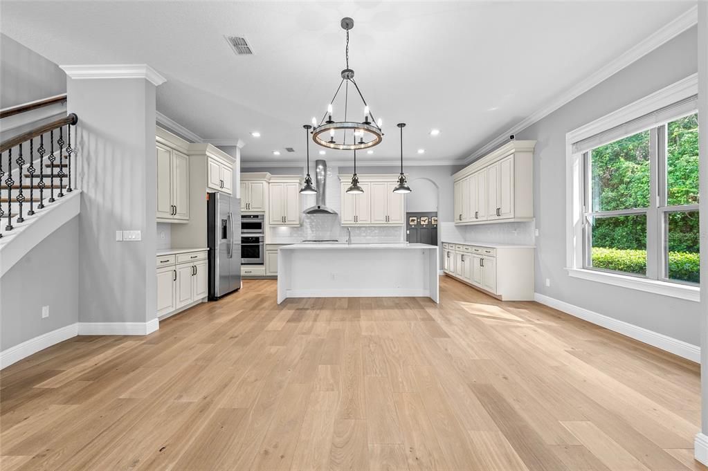 Chandelier, Interior, Kitchen, Pendant Lights, Recessed Lighting, Stainless Steel Appliances, Wood Texture Flooring