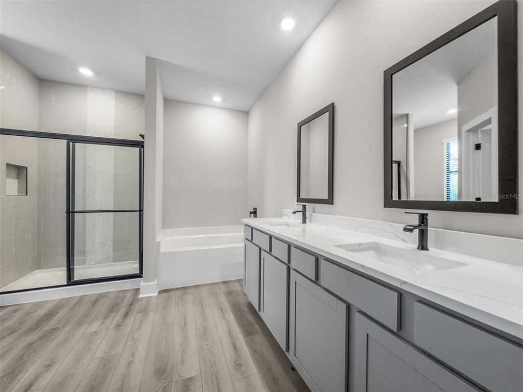 Bathroom, Dual Sink Vanities, Glass Shower, Interior, Recessed Lighting, Wood Texture Flooring