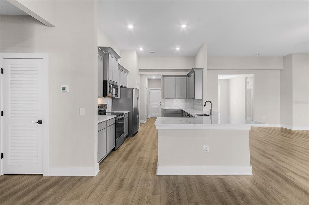 Interior, Kitchen, Recessed Lighting, Stainless Steel Appliances, Wood Texture Flooring