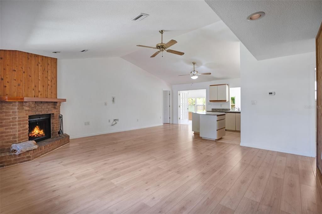 Empty room, Fireplace, Interior, Kitchen, Recessed Lighting, Wood Texture Flooring