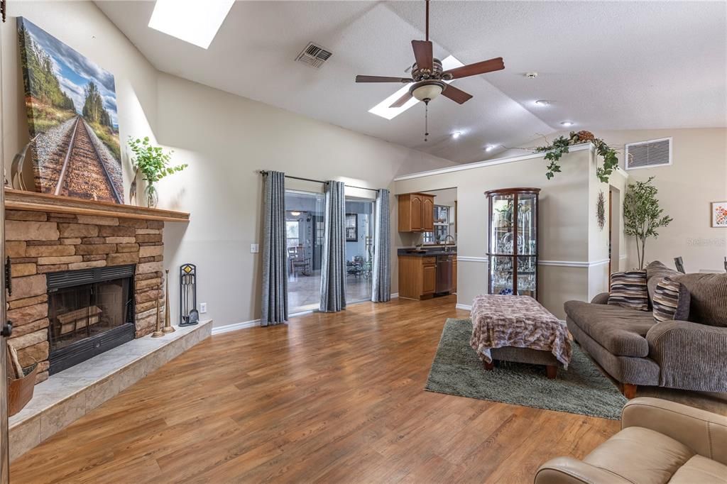 Fireplace, Interior, Kitchen, Living room, Recessed Lighting, Wood Texture Flooring