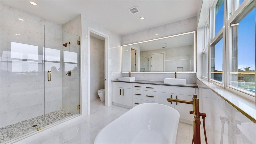 Bathroom, Dual Sink Vanities, Free Standing Baths, Glass Shower, Interior, Marble, Marble Walls, Recessed Lighting