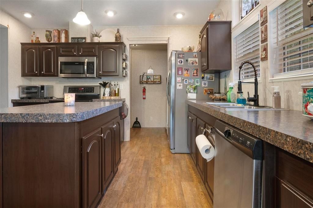 Interior, Kitchen, Pendant Lights, Recessed Lighting, Stainless Steel Appliances, Wood Texture Flooring