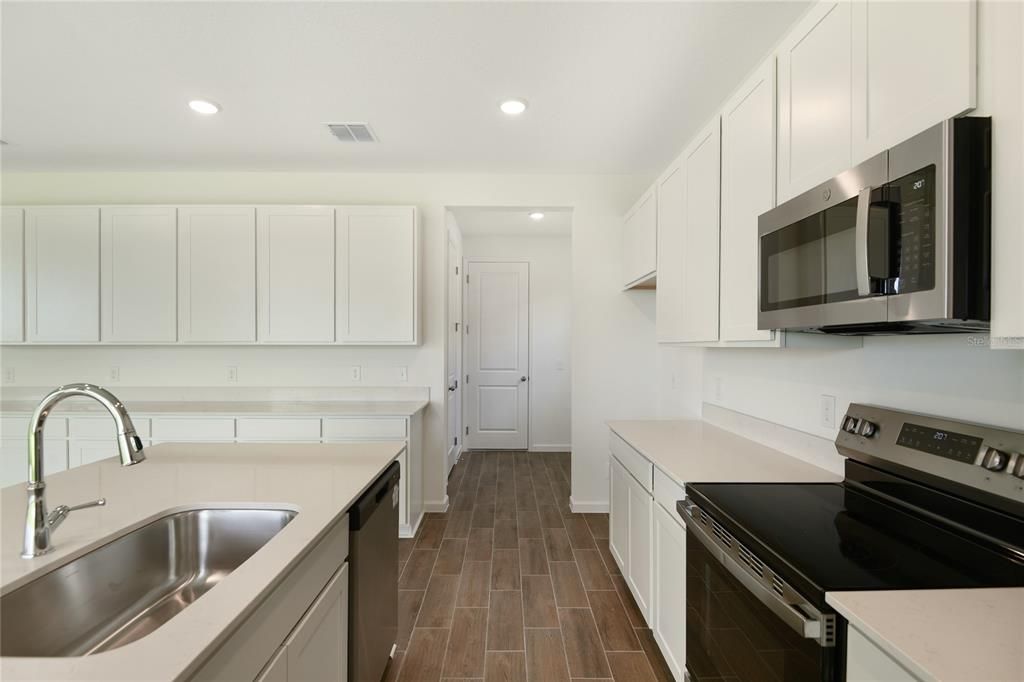 Interior, Kitchen, Recessed Lighting, Stainless Steel Appliances, Wood Texture Flooring