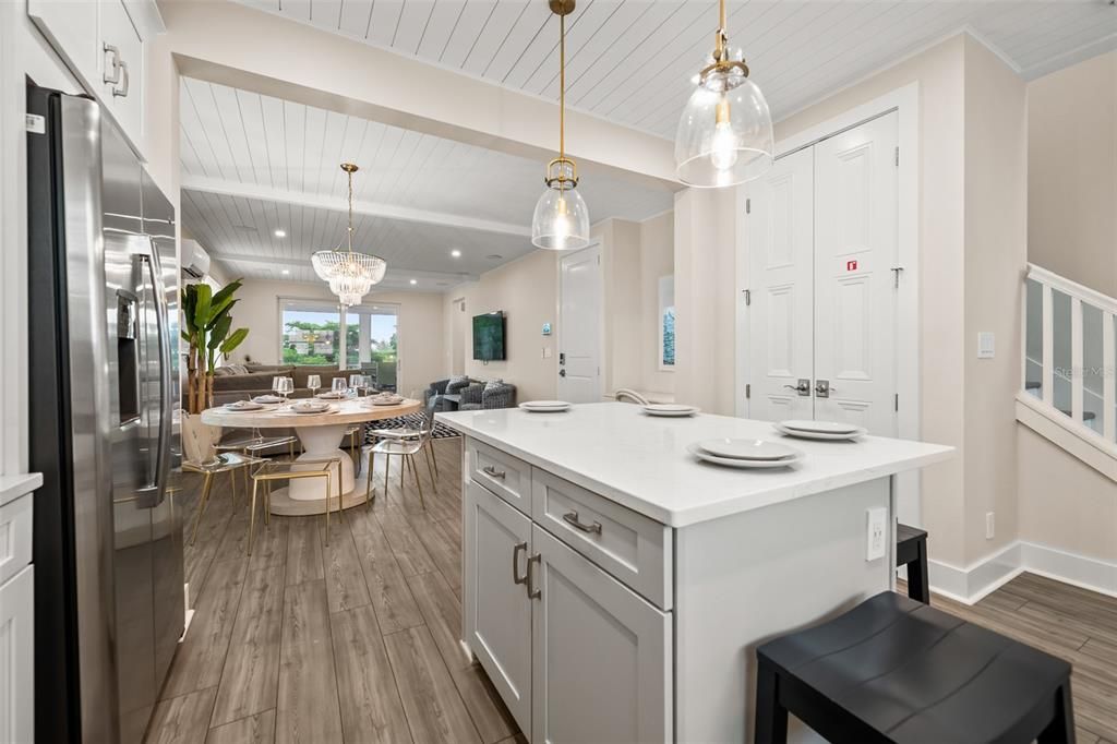 Chandelier, Dining room, Interior, Kitchen, Pendant Lights, Recessed Lighting, Stainless Steel Appliances, Wood Texture Flooring