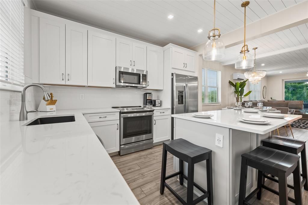 Chandelier, Interior, Kitchen, Pendant Lights, Recessed Lighting, Stainless Steel Appliances, Wood Texture Flooring