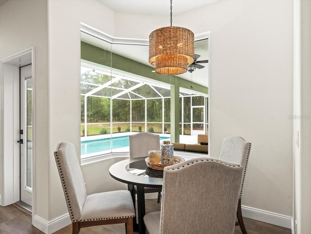 Chandelier, Dining room, Glass Ceilings, Interior, Pool, Sun Room, Wood Texture Flooring