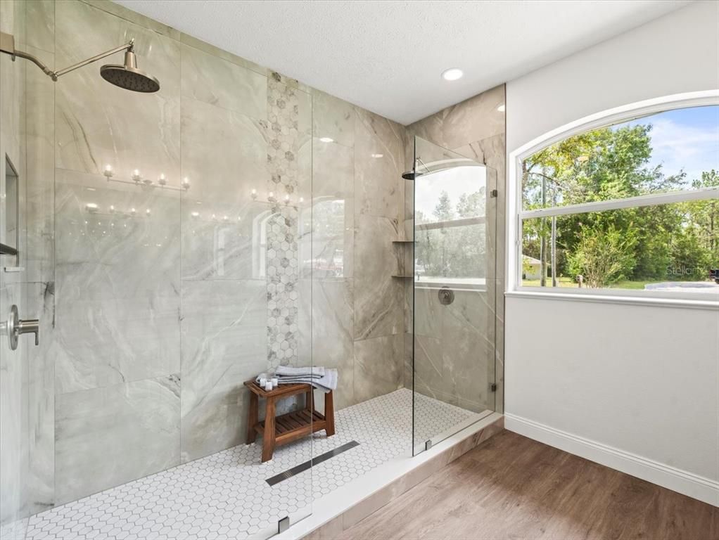 Bathroom, Glass Shower, Interior, Marble Walls, Recessed Lighting, Wood Texture Flooring