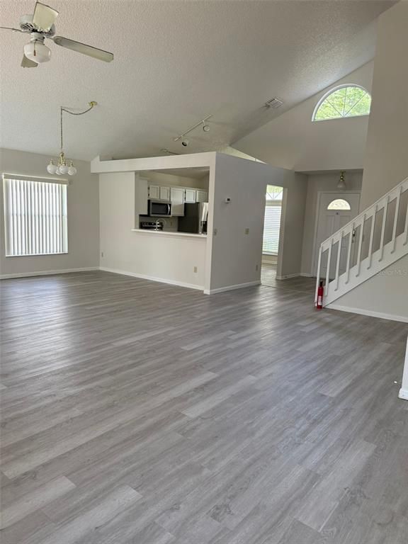 Chandelier, Empty room, Interior, Kitchen, Stainless Steel Appliances, Wood Texture Flooring