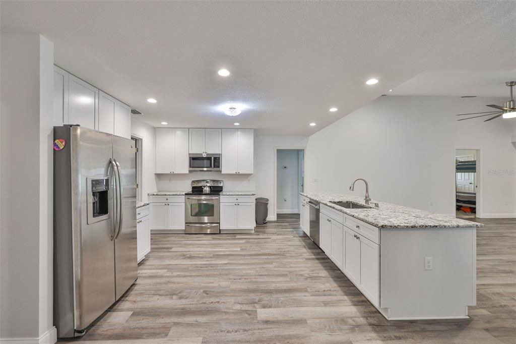 Interior, Kitchen, Recessed Lighting, Stainless Steel Appliances, Wood Texture Flooring