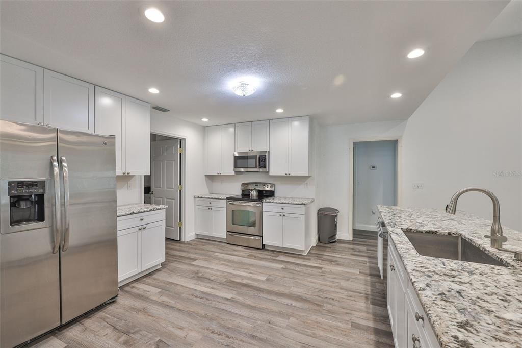 Interior, Kitchen, Recessed Lighting, Stainless Steel Appliances, Wood Texture Flooring