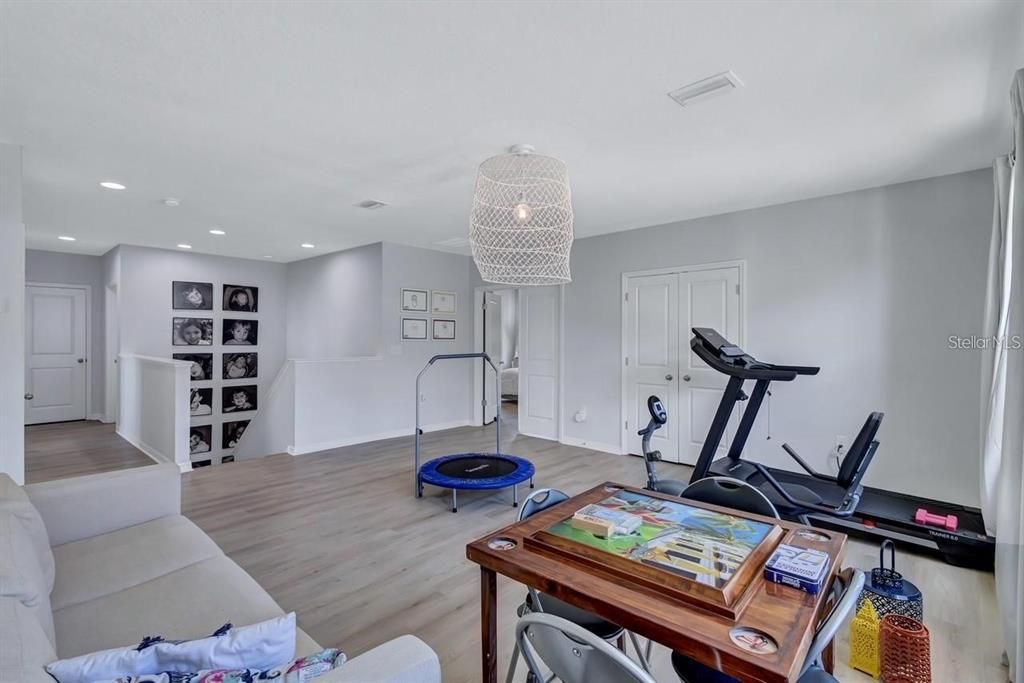 Chandelier, Fitness Equipment, Interior, Recessed Lighting, Wood Texture Flooring