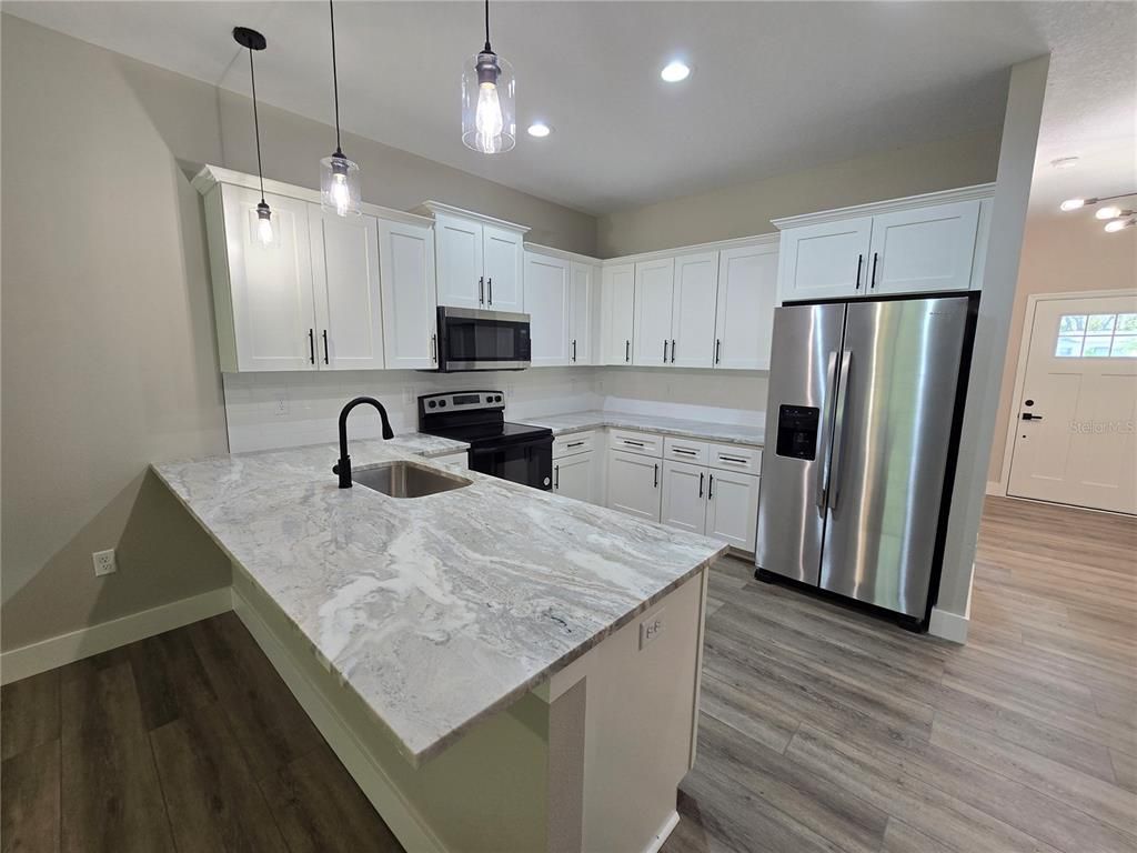 Interior, Kitchen, Pendant Lights, Recessed Lighting, Stainless Steel Appliances, Wood Texture Flooring