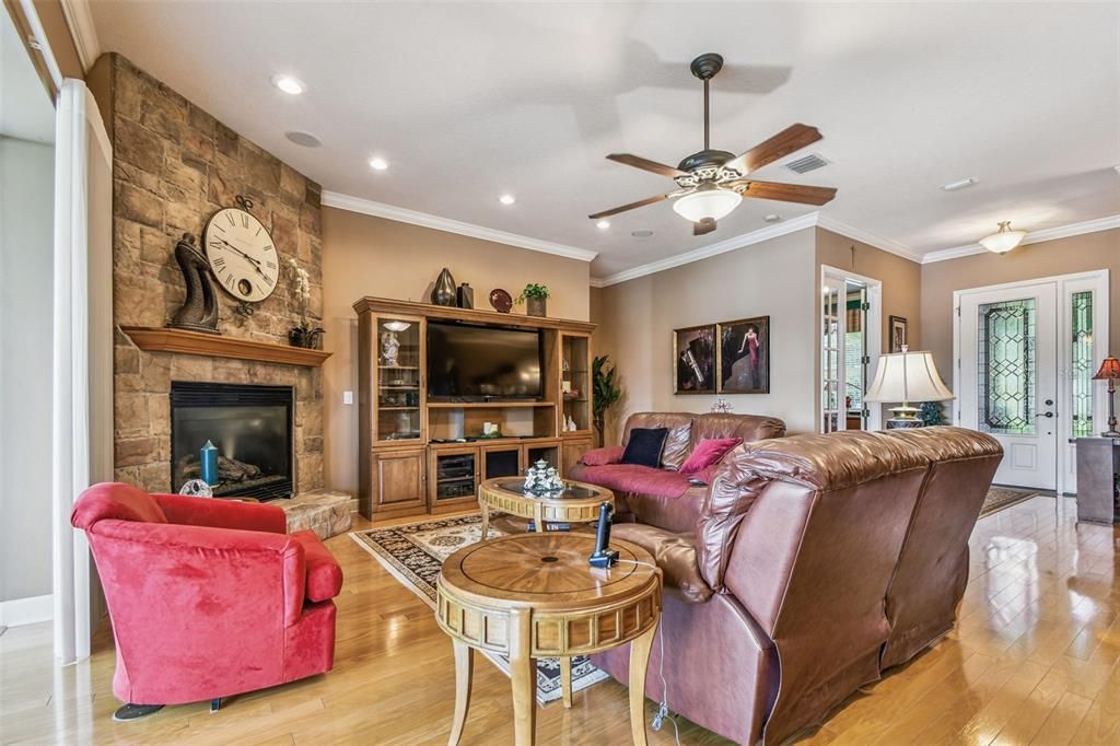 Fireplace, Interior, Living room, Recessed Lighting, Stone Walls, Wood Texture Flooring