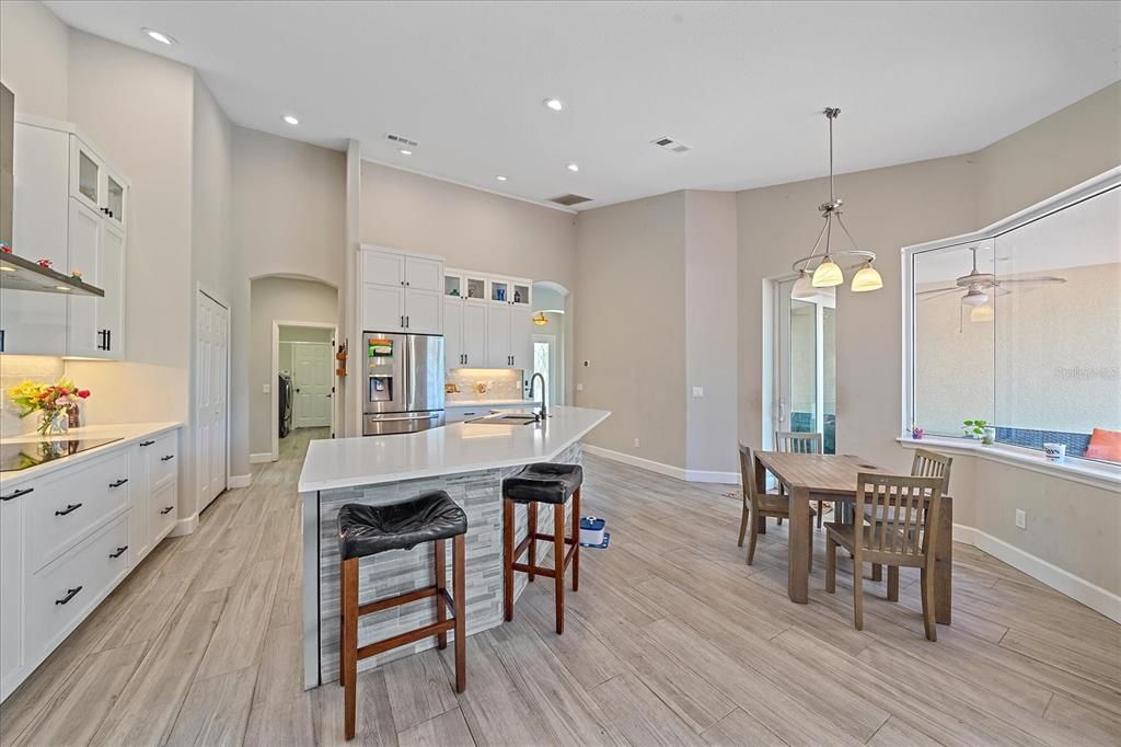 Dining room, Interior, Kitchen, Pendant Lights, Recessed Lighting, Stainless Steel Appliances, Wood Texture Flooring