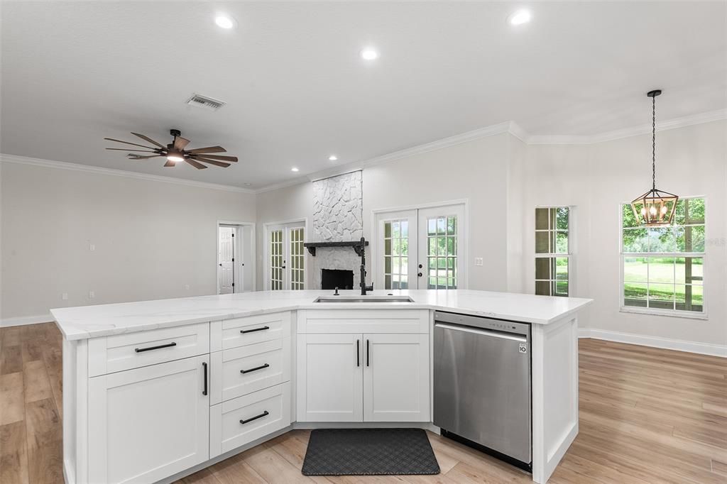 Fireplace, Interior, Kitchen, Pendant Lights, Recessed Lighting, Stone Walls, Wood Texture Flooring