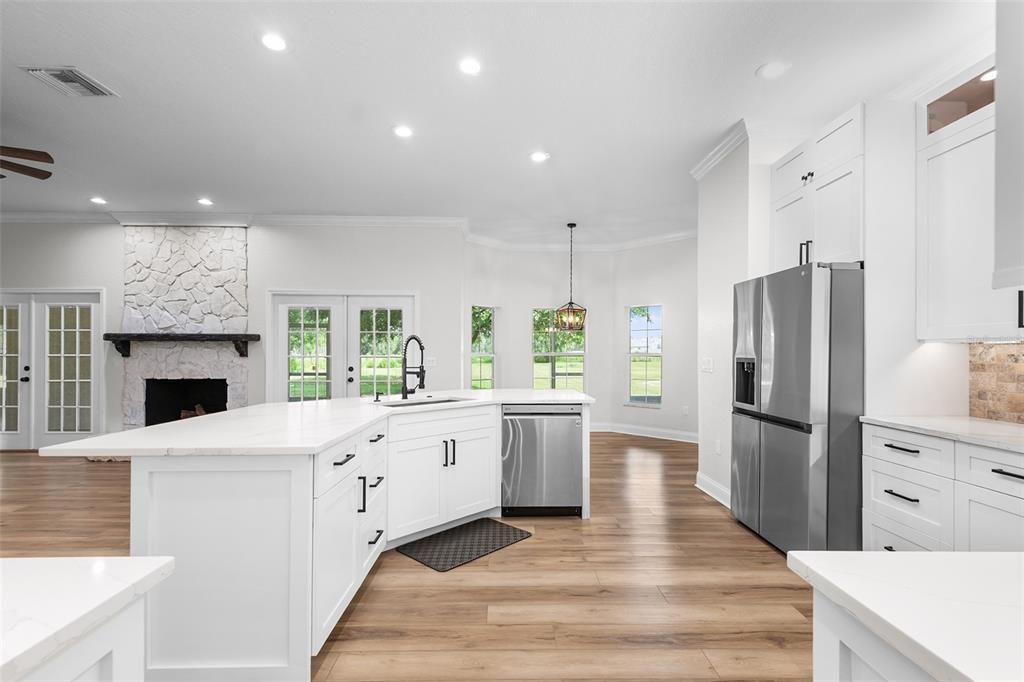 Fireplace, Interior, Kitchen, Pendant Lights, Recessed Lighting, Stone Walls, Wood Texture Flooring