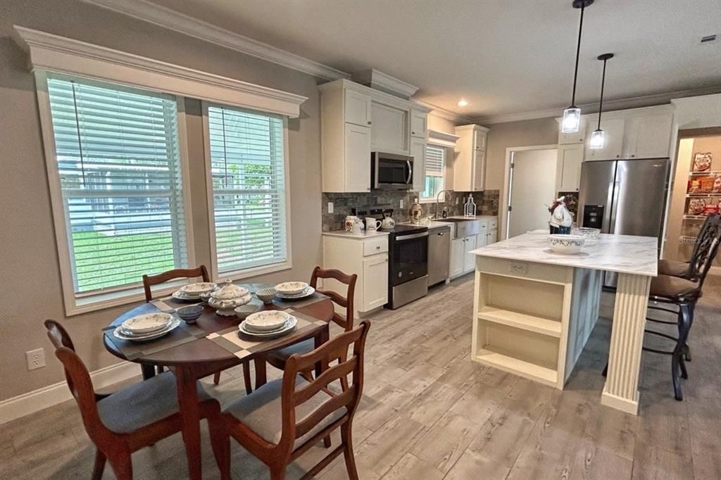Dining room, Interior, Kitchen, Pendant Lights, Recessed Lighting, Stainless Steel Appliances, Wood Texture Flooring