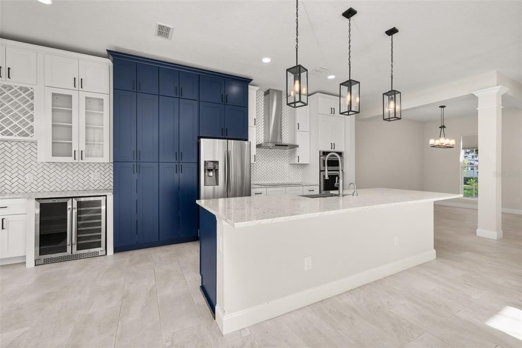 Chandelier, Interior, Kitchen, Pendant Lights, Recessed Lighting, Stainless Steel Appliances, Wood Texture Flooring