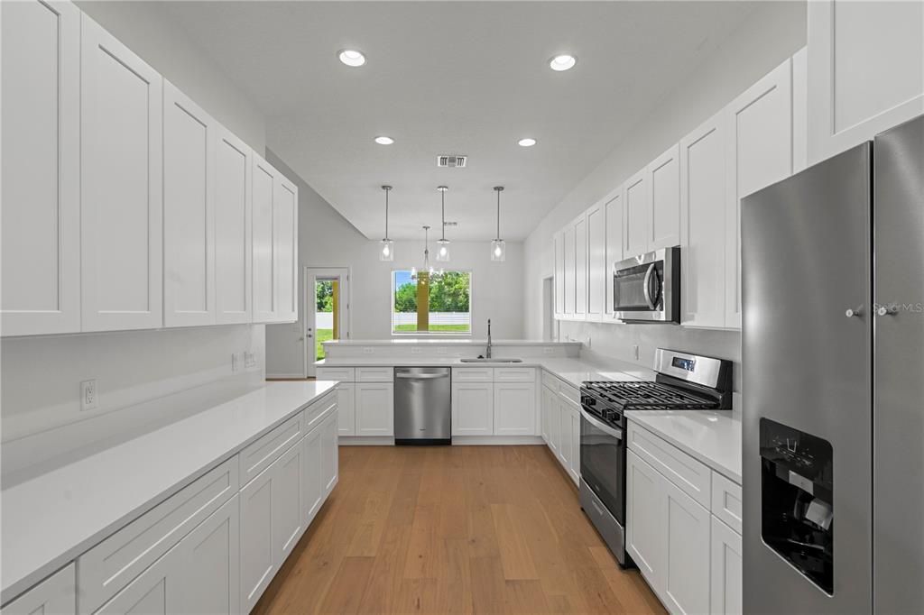 Interior, Kitchen, Pendant Lights, Recessed Lighting, Stainless Steel Appliances, Wood Texture Flooring