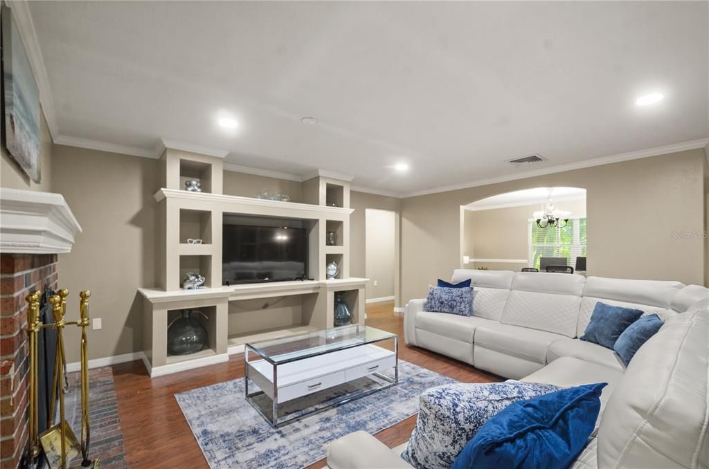 Chandelier, Fireplace, Interior, Living room, Recessed Lighting, Wood Texture Flooring