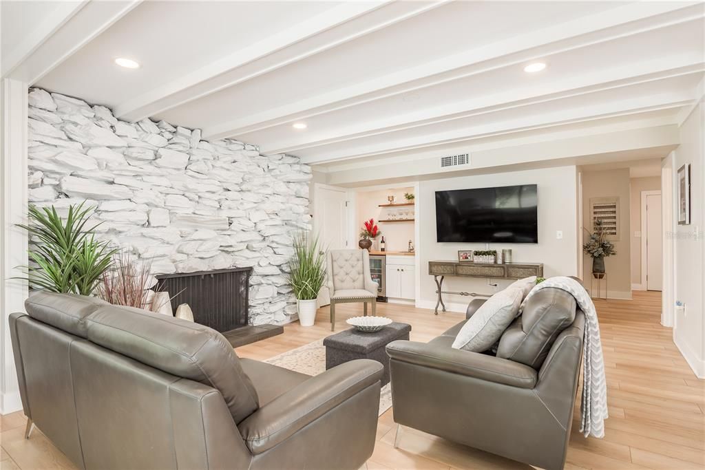 Fireplace, Interior, Living room, Recessed Lighting, Stone Walls, Wood Texture Flooring