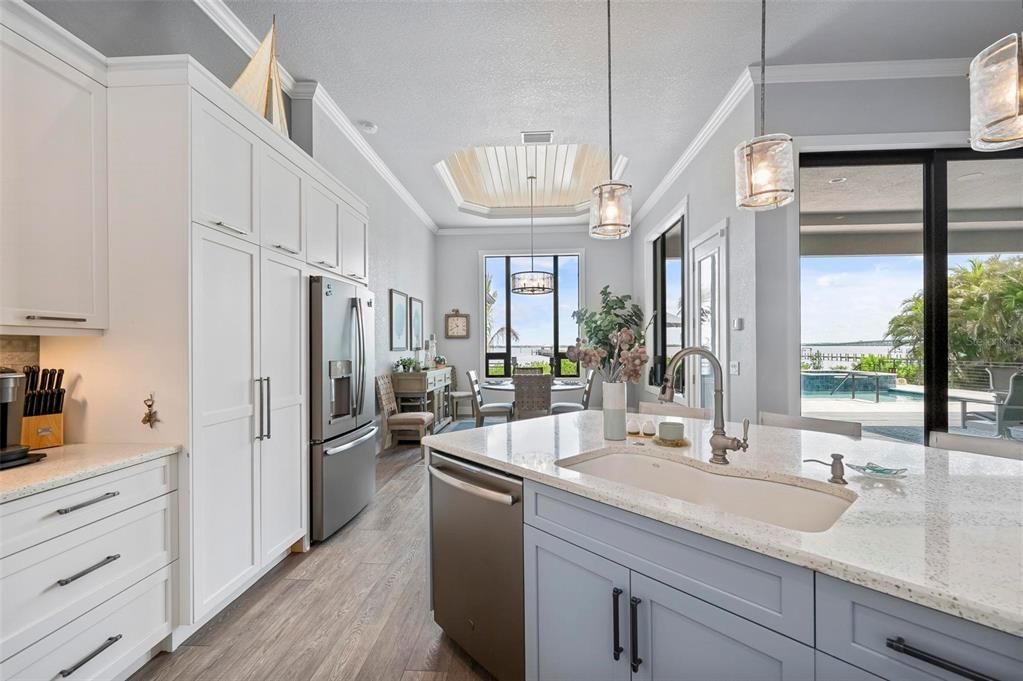 Dining room, Interior, Kitchen, Pendant Lights, Stainless Steel Appliances, Water, Wood Texture Flooring