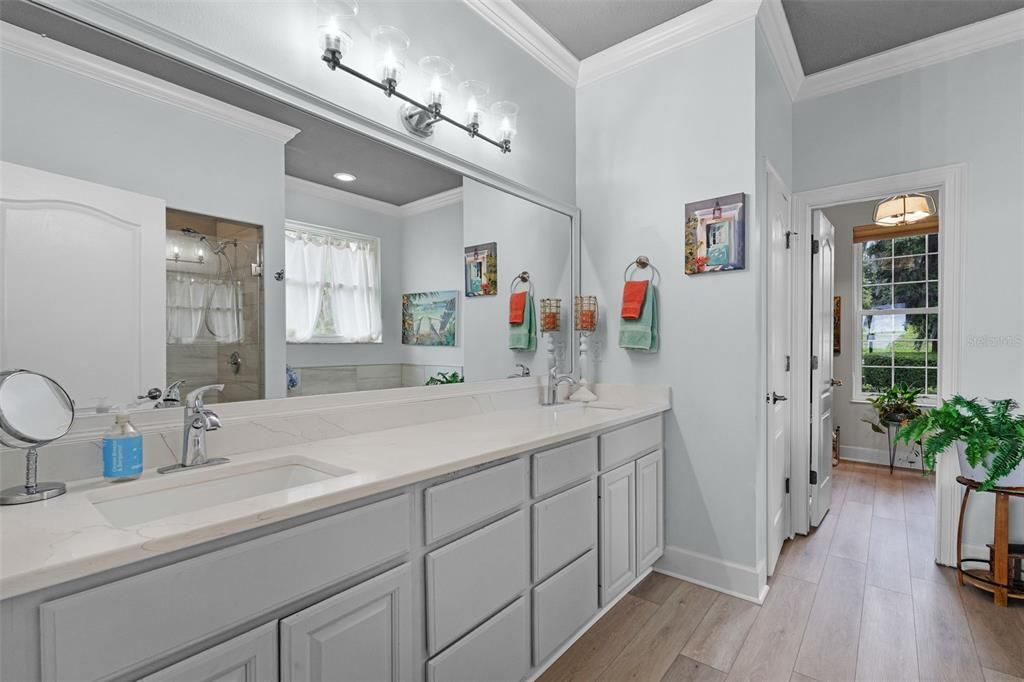 Bathroom, Dual Sink Vanities, Glass Shower, Interior, Recessed Lighting, Wood Texture Flooring