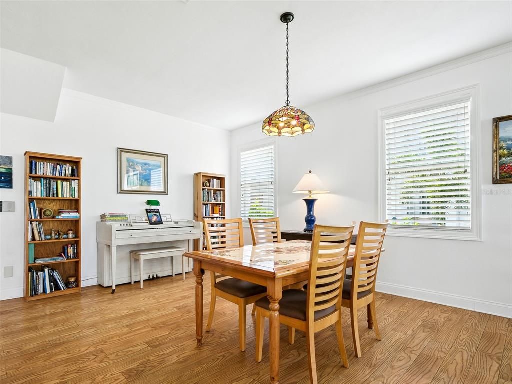 Dining room, Interior, Pendant Lights, Piano, Wood Texture Flooring