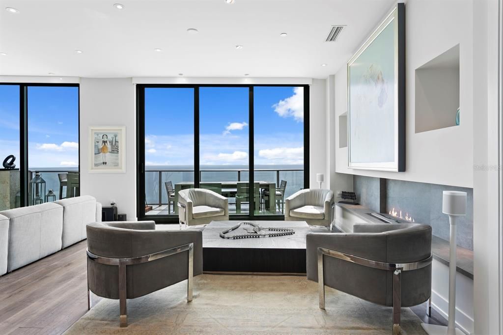 Fireplace, Interior, Living room, Recessed Lighting, Water, Wood Texture Flooring