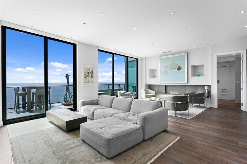 Fireplace, Interior, Living room, Recessed Lighting, Water, Wood Texture Flooring