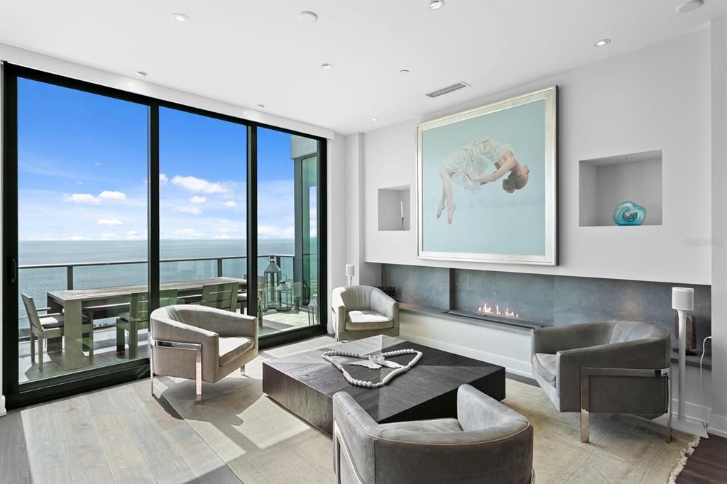 Fireplace, Interior, Living room, Recessed Lighting, Water, Wood Texture Flooring