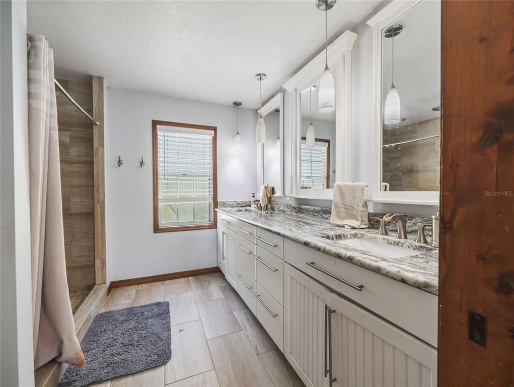 Bathroom, Dual Sink Vanities, Interior, Pendant Lights, Wood Texture Flooring