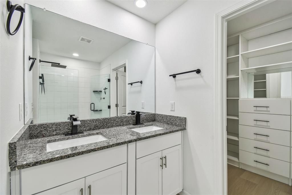 Bathroom, Dual Sink Vanities, Interior, Recessed Lighting, Walk-in Closets, Wood Texture Flooring