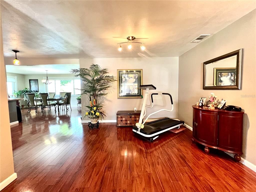 Dining room, Fitness Equipment, Interior, Pendant Lights, Wood Texture Flooring