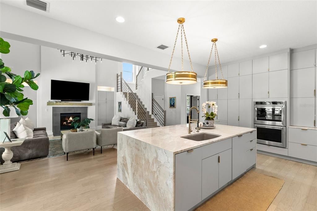 Fireplace, Interior, Kitchen, Living room, Pendant Lights, Recessed Lighting, Stainless Steel Appliances, Wood Texture Flooring