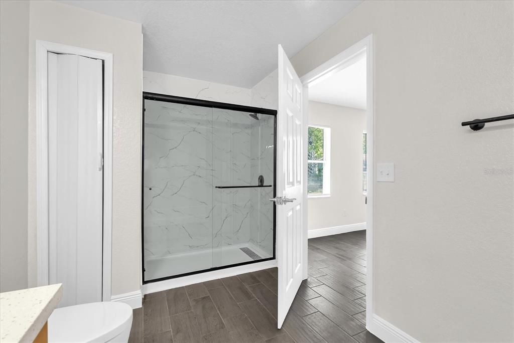 Bathroom, Glass Shower, Interior, Marble Walls, Wood Texture Flooring