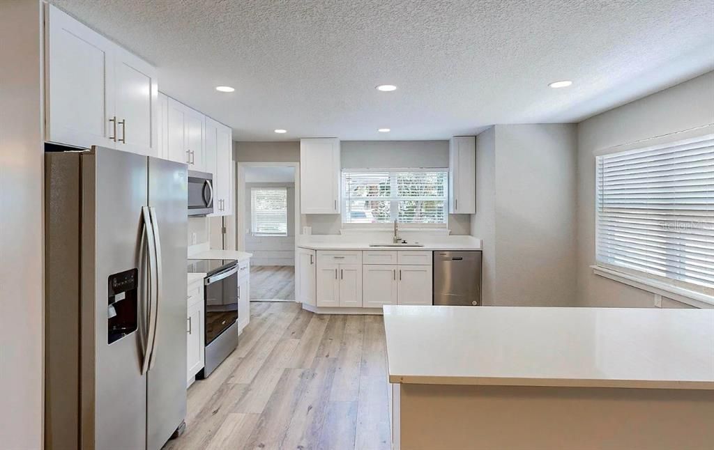 Interior, Kitchen, Recessed Lighting, Stainless Steel Appliances, Wood Texture Flooring