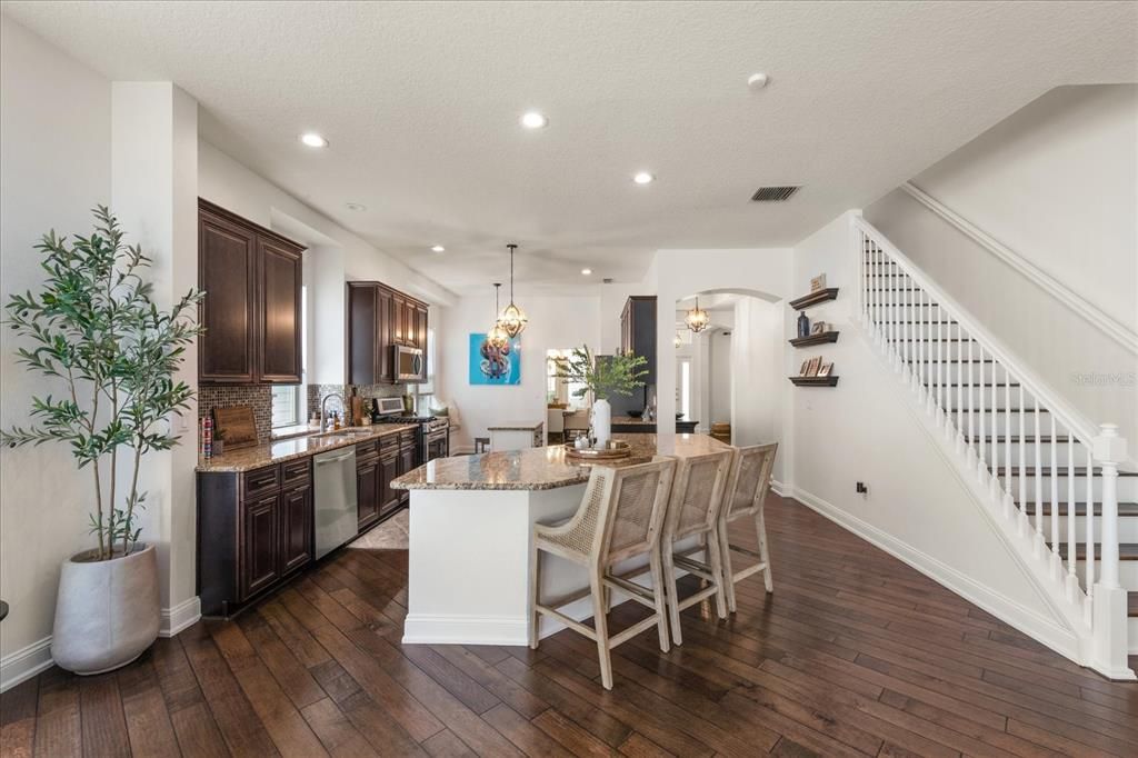 Dining room, Interior, Kitchen, Pendant Lights, Recessed Lighting, Stainless Steel Appliances, Wood Texture Flooring