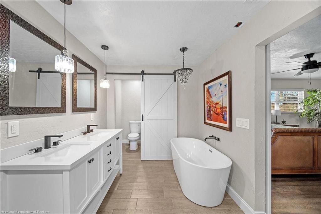 Bathroom, Dual Sink Vanities, Free Standing Baths, Interior, Pendant Lights, Wood Texture Flooring