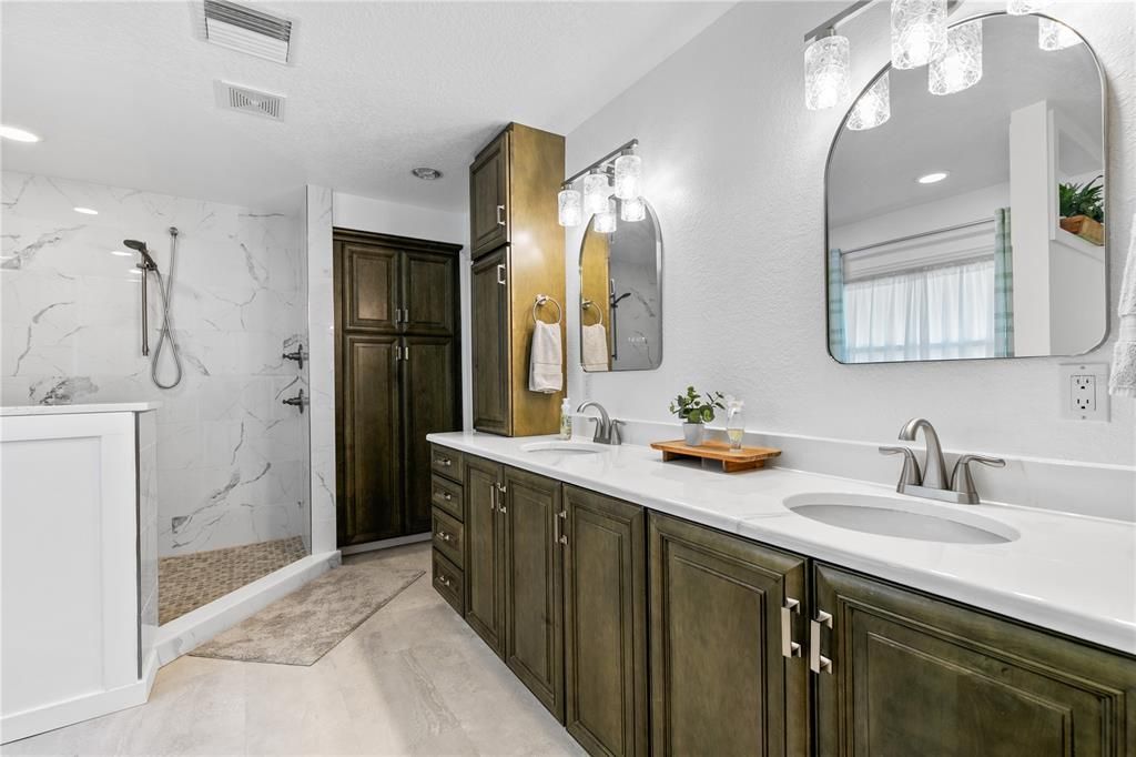 Bathroom, Dual Sink Vanities, Glass Shower, Interior, Marble, Marble Walls, Recessed Lighting