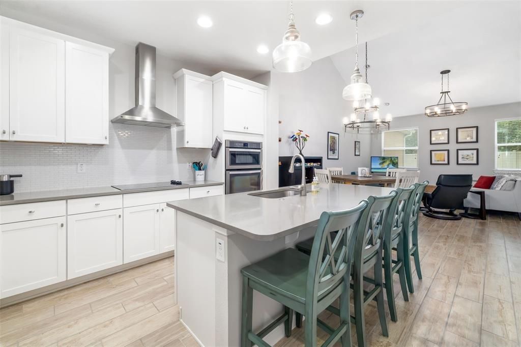 Dining room, Interior, Kitchen, Living room, Pendant Lights, Recessed Lighting, Stainless Steel Appliances, Wood Texture Flooring